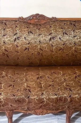 Carved wooden furniture thick with dust in the crevices before cleaning, and the same furniture with the carving cleaned out